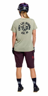 Troy Lee Designs Womens Lilium Ride Short Sleeve Tee Stamps Sage BACK FACING MODEL