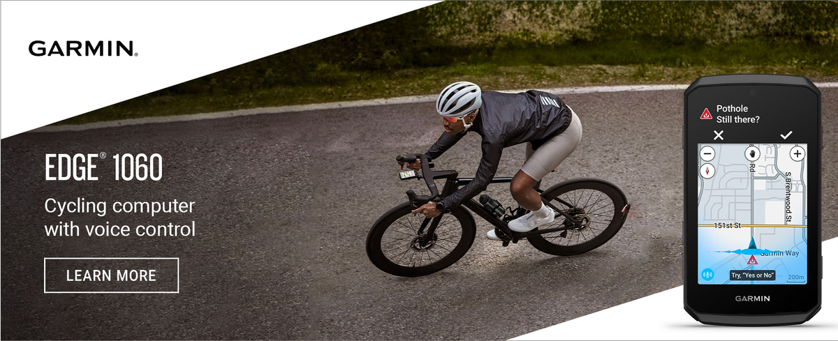 Garmin Edge 1060 cycling computer with voice control and cyclist on a road